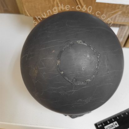 large sphere of black stone shungite