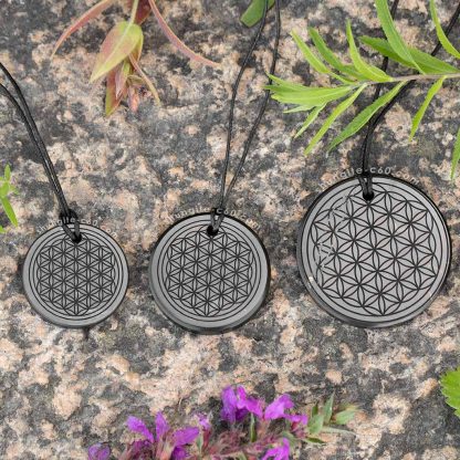 Three sizes of round protective jewelry with sacred geometry ornament