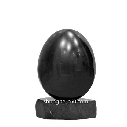 shungite present stone egg on a stand