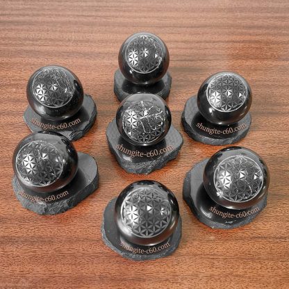black rock spheres with picture flower