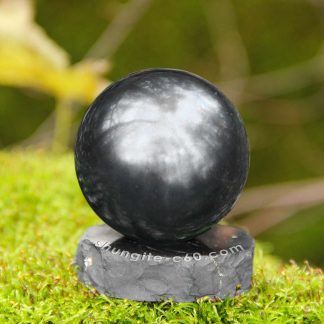 black sphere shungite on a stand