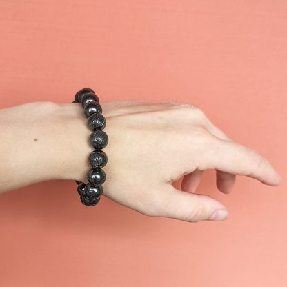 shungite Flower of Life bracelet beads on a hand