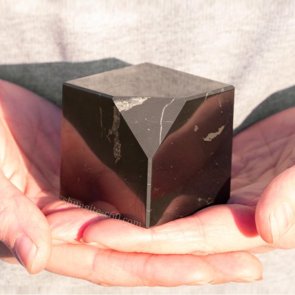 Flaying cube on a hand